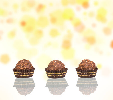 chocolate candy in tartlet form on colorful backgroundの写真素材