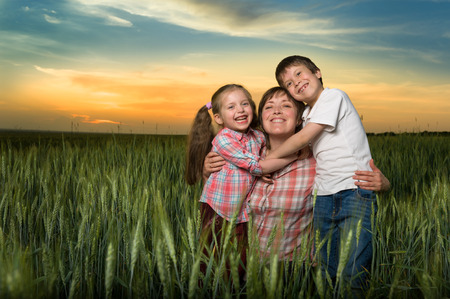 happy family at sunsetの写真素材