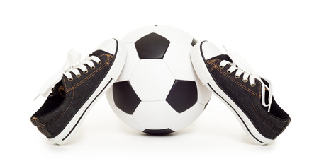 soccer ball and sport shoes on white isolatedの写真素材