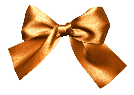 golden bow made from silk isolatedの写真素材