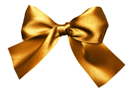 golden bow made from silk isolatedの写真素材
