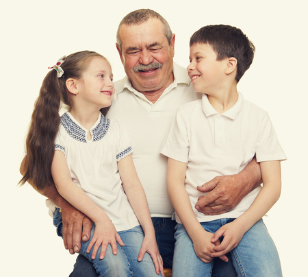 Grandfather and grandchildren portrait studio shootの写真素材