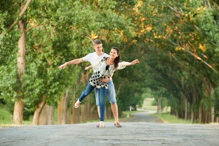 happy young couple walk on country outdoor, romantic people concept, summer seasonの写真素材
