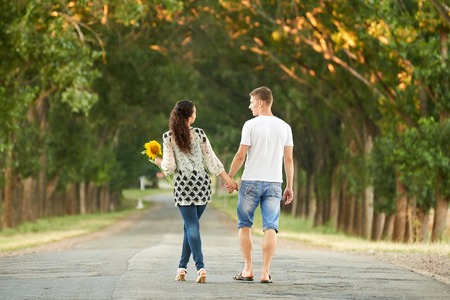 happy young couple walk on country outdoor, romantic people concept, summer seasonの写真素材