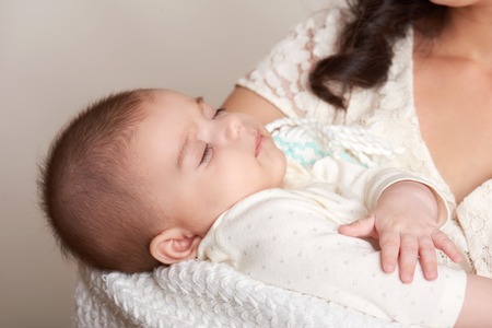 mother with sleeping baby portrait, happy maternity concept