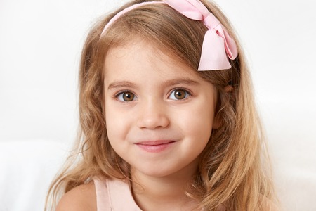 Adorable little child girl face closeup portraitの写真素材