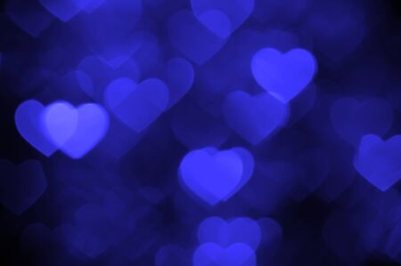 dark blue heart bokeh background photo, abstract holiday backdropの写真素材