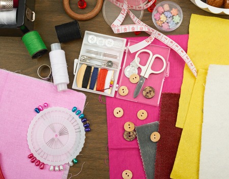 sewing accessories top view, seamstress workplace, many object for needlework and handicraft