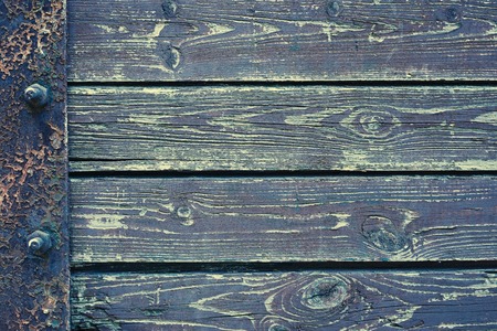 Wooden background from old plank boards with iron fastening, horizontal arrangement in a row