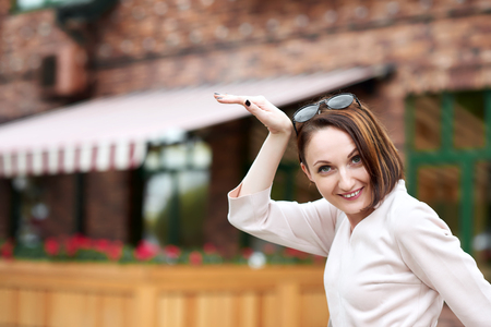 young girl posing in the street and having funの写真素材