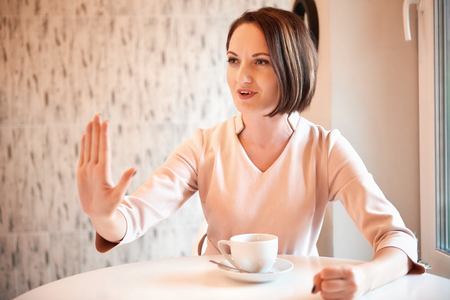 portrait of a young woman in a cafeの写真素材