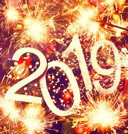 2019 abstract text on colorful background of christmas tree and lights - bright holiday backdrop