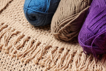 Balls of woolen thread for knitting on wooden backgroundの写真素材