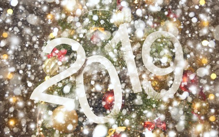 2019 abstract text on the background of christmas tree and lights - bright holiday backdropの写真素材