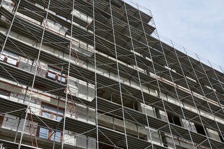 new building under construction, scaffolding and concreteの写真素材