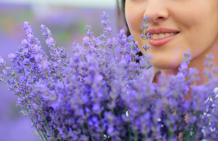 beautiful woman face with lavender flowerの写真素材