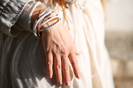 hand of fashionable girl dressed in white