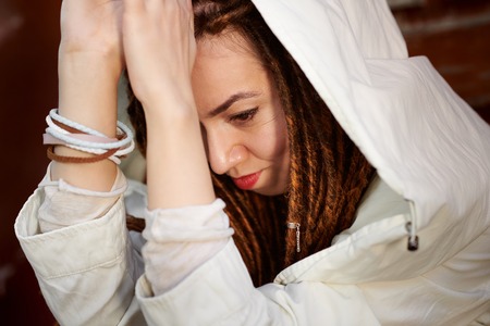 dreadlocks fashionable girl portrait, dressed in whiteの写真素材