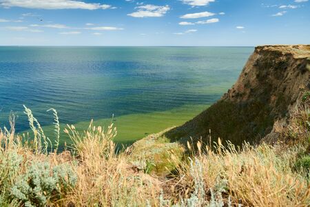 Wild sea coast, wave and hill - beautiful summer landscape and travel concept, bright day and sky...