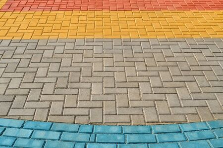 yellow, red and blue paving tiles for background or texture