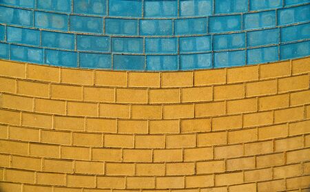 yellow and blue paving tiles for background or textureの写真素材