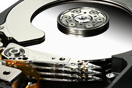 Disassembled computer hard disk drive, hdd with mirror effect. Macro photo. Opened hard drive,...
