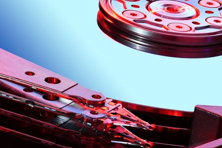 Disassembled computer hard disk drive, hdd with mirror effect. Macro photo. Opened hard drive,...
