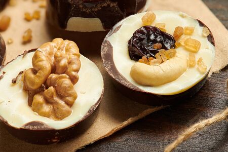 Homemade chocolate candies on rustic table, sweet food, macro photoの写真素材