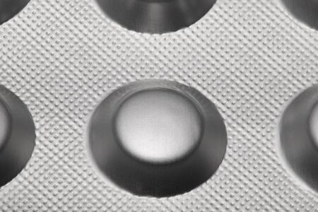 Tablets in blister pack arranged with beautiful pattern. Global healthcare concept. Antibiotics drug...