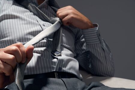 businessman with a pill, hands close view - concept of difficulties, depression, problems, health and stress, risk of modern businessの写真素材