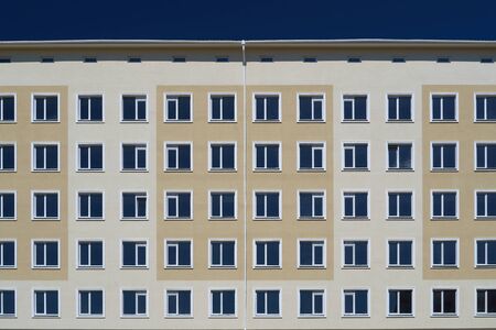 facade of a new multi-storey building with many windowsの写真素材