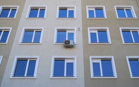 one air conditioner outside unit on a facade of residential buildingの写真素材