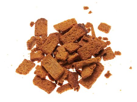 rye crackers, small dried pieces of bread with spices, delicious fast food isolated on white backgroundの写真素材