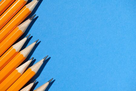 graphite pencils on a blue background macro photo, school and office suppliesの写真素材
