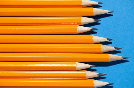 graphite pencils on a blue background macro photo, school and office suppliesの写真素材