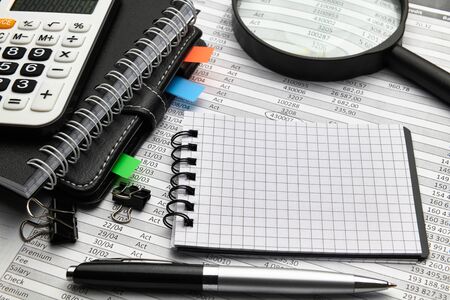 Top view of office worker's desk - work with financial reports, analysis and accounting, tables and...