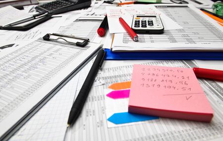 Top view of office worker's desk - work with financial reports, analysis and accounting, tables and...