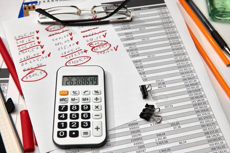 Top view of office worker's desk - work with financial reports, analysis and accounting, tables and...