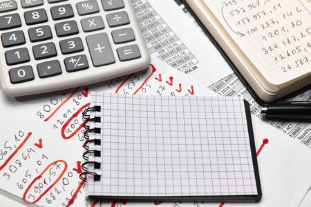 Top view of office worker's desk - work with financial reports, analysis and accounting, tables and...
