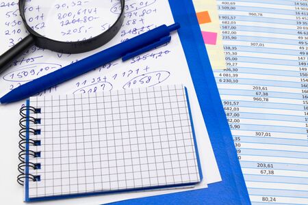 business office desk closeup - financial reports, analysis and accounting, set of documents, tables...