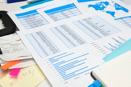 business office desk closeup - financial reports, analysis and accounting, set of documents, tables...