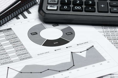 business office desk closeup - financial reports, analysis and accounting, set of documents, tables...