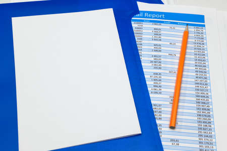 business office desk closeup - financial reports, analysis and accounting, set of documents, tables and graphs, various items for bookkeeping, calculatorの写真素材