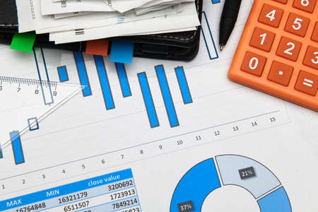 business office desk closeup - financial reports, analysis and accounting, set of documents, tables...
