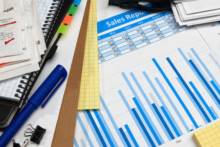 business office desk closeup - financial reports, analysis and accounting, set of documents, tables...