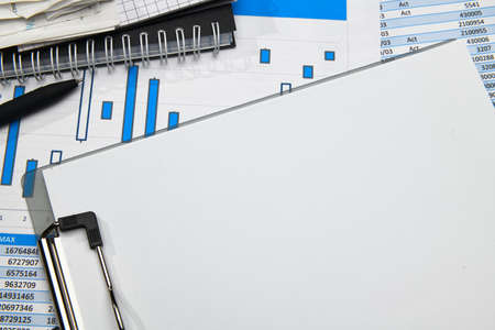 business office desk closeup - financial reports, analysis and accounting, set of documents, tables...