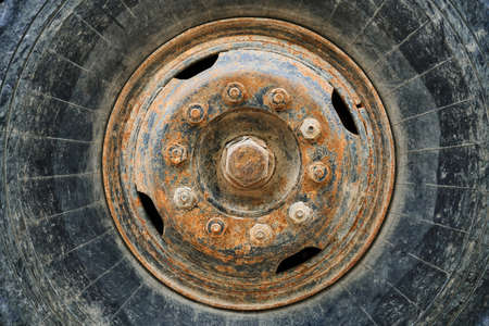 big wheel close view of old tractor as backgroundの写真素材