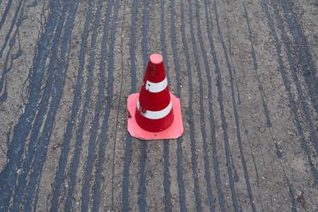 road construction or repair - laying a new layer of asphalt, marking the level for increased...