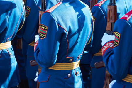 military parade in a city, soldiers in full dress uniforms ordered in parade formation, russian text on the Chevron - armed forces of Transnistriaのeditorial素材