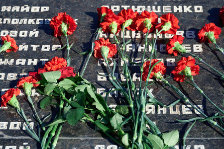 Tiraspol, Transnistria - September 2, 2020: date 30th anniversary of independence, flowers on the memorial to fallen soldiers, Russian text with different namesのeditorial素材